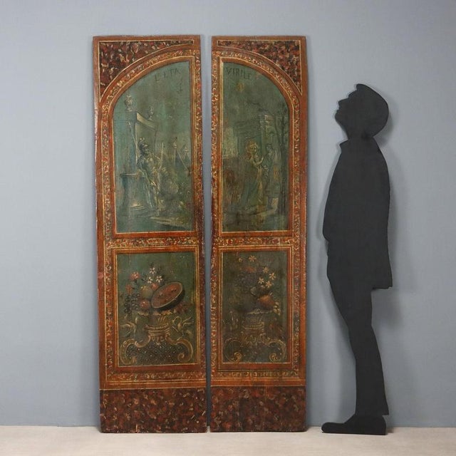 A pair of painted fir panels, made from antique wardrobe doors. The upper arched panels depict a genre scene depicting...