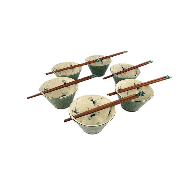 A distinctive set of six Bat Trang ceramic bowls, handcrafted in Vietnam with a beautiful contrast of deep celadon green...