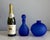 Rich cobalt-blue color and softly frosted surfaces give this coordinating glass duo a sculptural presence. The rounded...