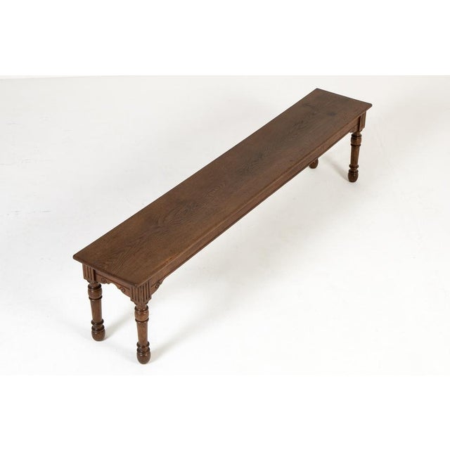 A large 19th century english oak hall bench. of large scale, this hall bench is made of oak of excellent colour and...