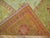 An early 20th century square size antique Turkish Oushak featuring an-all over design in warm colors. Measures: 12' x...