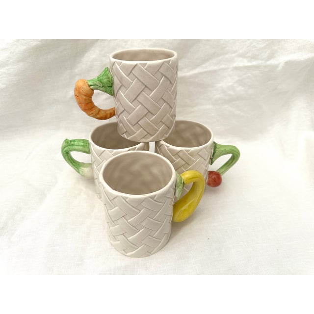 Vintage set of 4 Fitz & Floyd Kitchen Harvest Coffee Mugs. Off white in color with a basketweave detail, veggie handles...