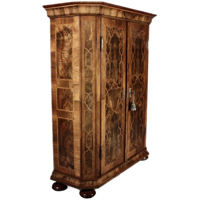 Age and Origin: The cabinet is likely from around 1740-50 and probably originates from Germany or Austria. Dimensions:...