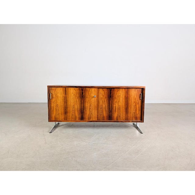 We are offering a beautiful vintage sideboard with two sliding doors from the 1950s-60s for sale. This sideboard, which...