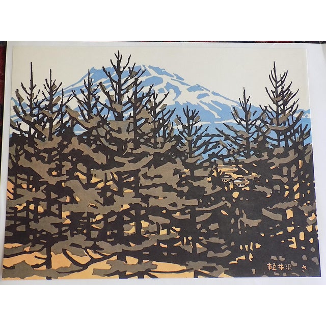 This pair of signed vintage Japanese lithographs depict Japanese expressionist landscape woodblock prints by Saburo Miyata...