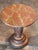 Round side table with a faux-marble painted top over a turned pedestal base. The painted surface shows age-use and...