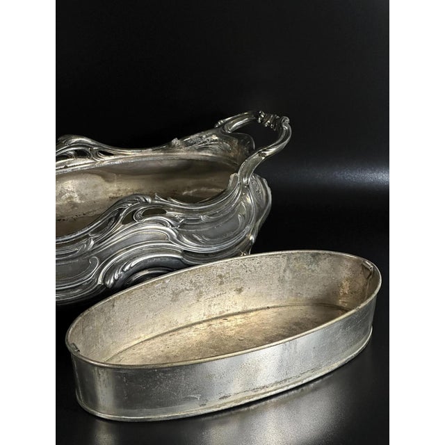 This magnificent French silver-plated jardinière is a masterful example of the Rococo Revival style, attributed to the...