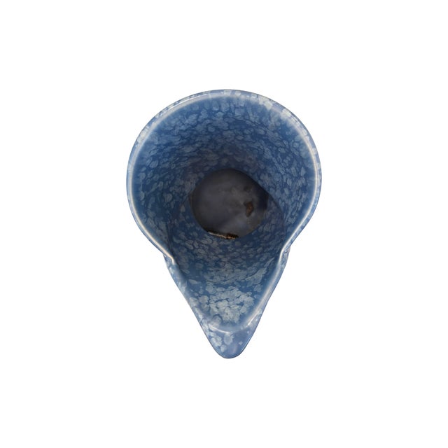 Vintage mid-century art pottery pitcher. Features a dramatic, asymmetrical biomorphic folded rim and an integrated elegant...