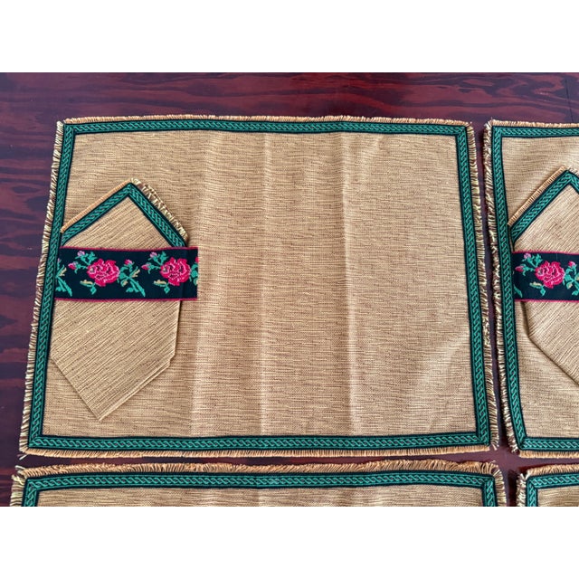 Midcentury set of four handmade placemats with matching napkins. The placemats are a gold mustard woven fabric with...