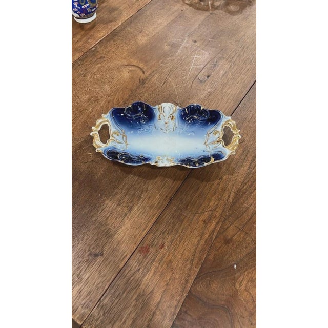 Add classic Victorian elegance to your table setting or dresser with this gorgeous porcelain dish. Featuring a striking...