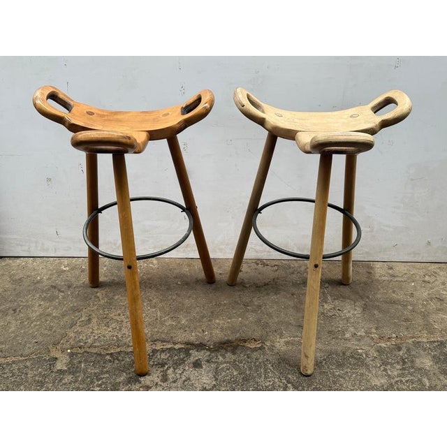 A pair of Marbella bar stools from Conform Manuform, Spain 1970s. Construction made of colored beech, and the seat has the...