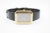 This is a classic Harry Winston watch. It is gold and black leather. The face watch is 18k gold with stepped bezel and...