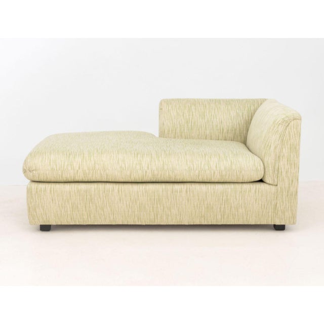 Contemporary Upholstered Chaise Lounge, with green and cream colored abstract upholstery. 27" H x 61.5" W x 31" D....