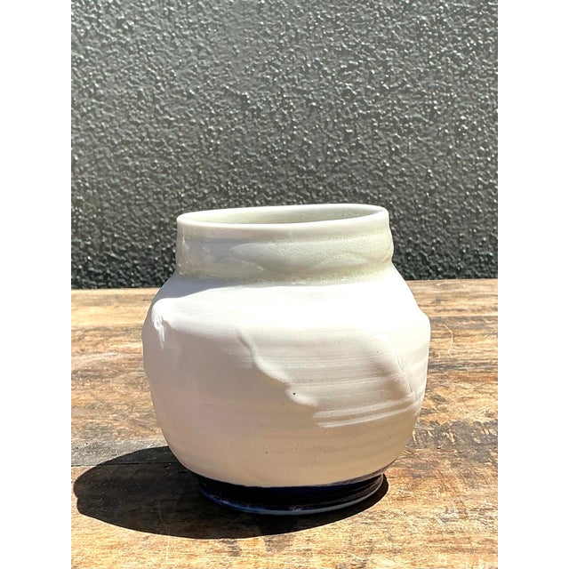 This sophisticated vintage studio pottery vase embodies the refined geometric playfulness and textural contrast of the...