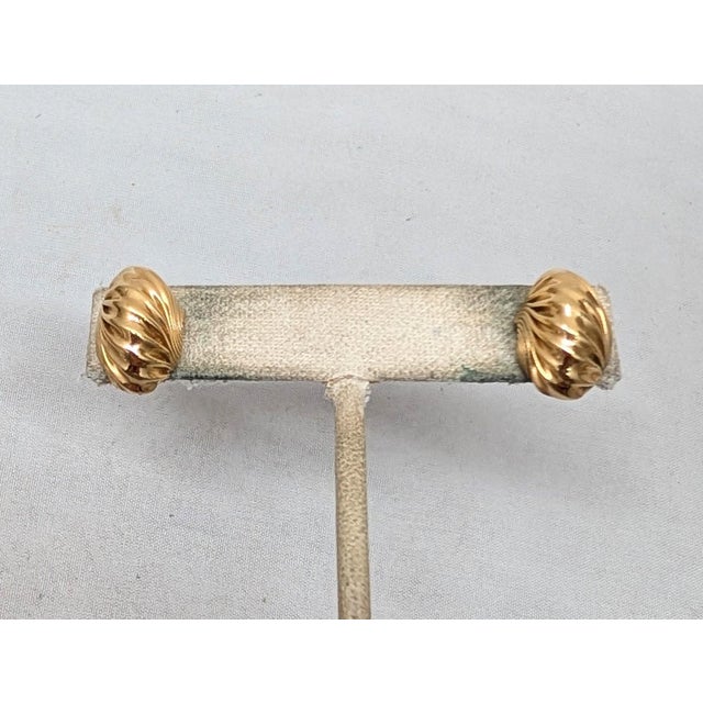 1970s goldtone "ruched" half hoop pierced push back earrings. Marked "NAPIER©" on the backs. Measure: 5/8 inches long by...