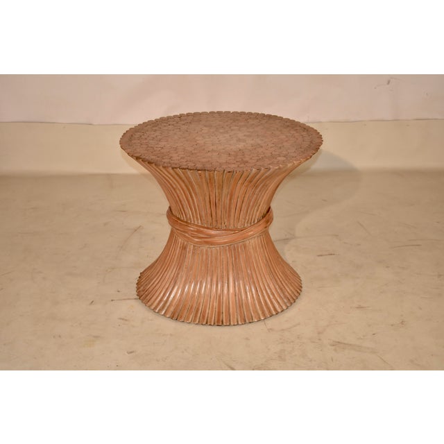 Circa 1970's wheat sheaf side table made from reed. This is a gorgeous side table with a sweeping design. The table is in...