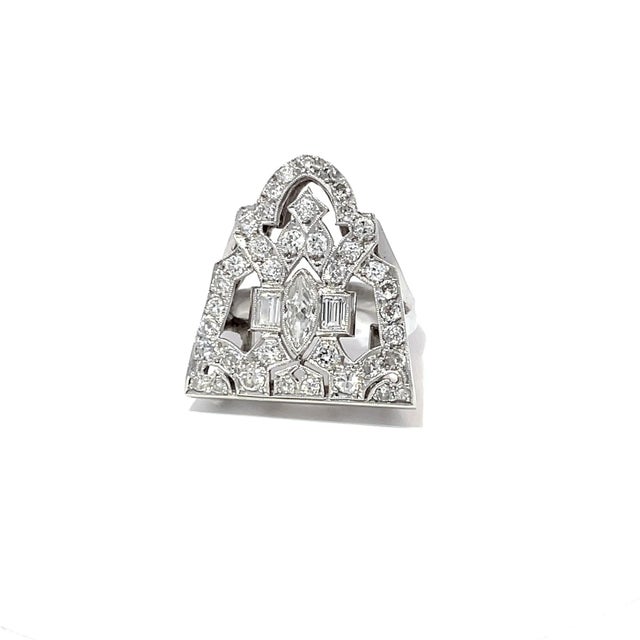 This exquisite antique diamond-studded cocktail ring, dating back to the 1920s, is a stunning example of Art Deco...