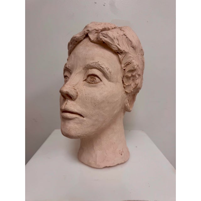 Vintage hand-built figural ceramic head sculpture with an expressive face, textured hair, and raw studio-made surface. The...