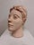 Vintage hand-built figural ceramic head sculpture with an expressive face, textured hair, and raw studio-made surface. The...