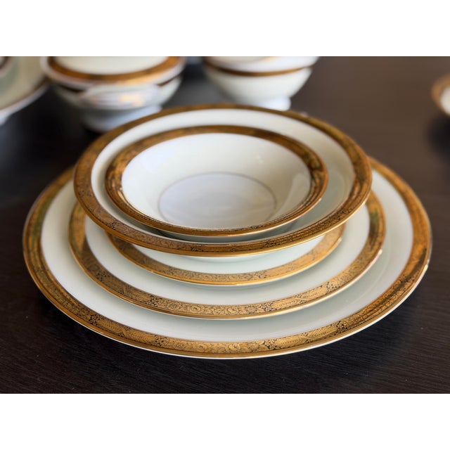 Beautiful Noritake 12 piece set of China with gold and black trim. Excellent condition! Would be great with Black table...