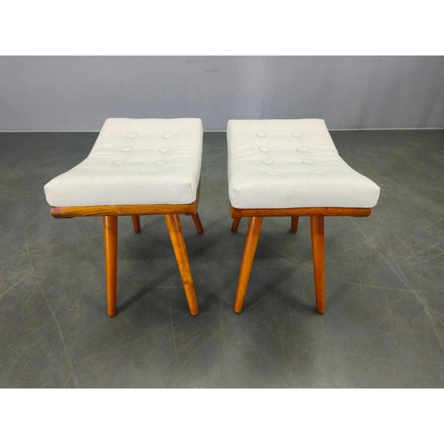 Refined pair of mid-century maple wood stools produced in czechoslovakia in the 1960s. The design features sculptural...
