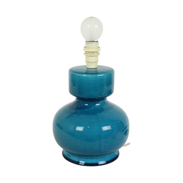 Beautiful Italian lamp made of blue or turquoise glazed ceramic with a crackle effect, circa 1970s, unmarked. This lamp...