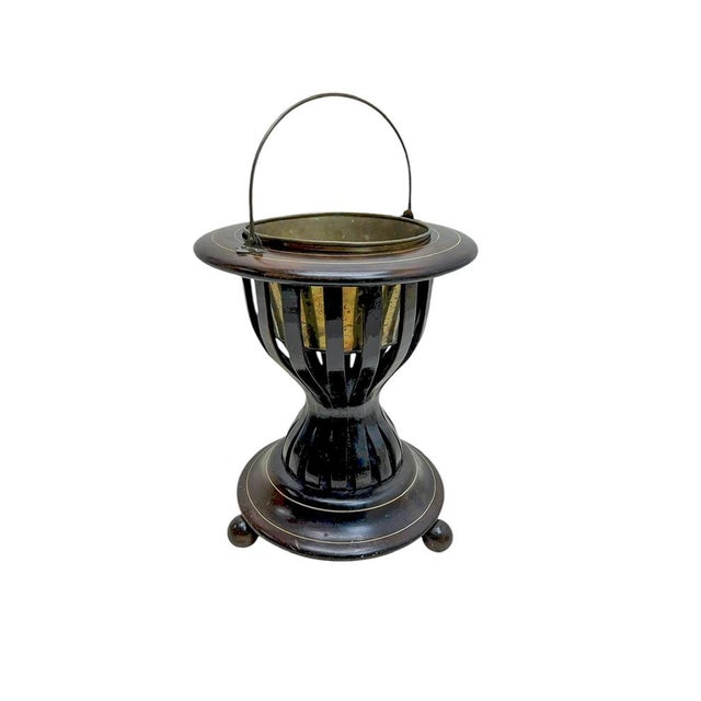 An Antique Dutch Tea Stove or Tea Kettle Warmer. Made from dark Mahogany with a cylindrical top with slatted sides and...