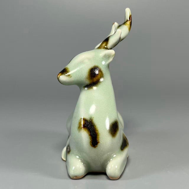 This charming deer‑form ornament is crafted from authentic Longquan‑Celadon. It features classic celadon‑green glaze...