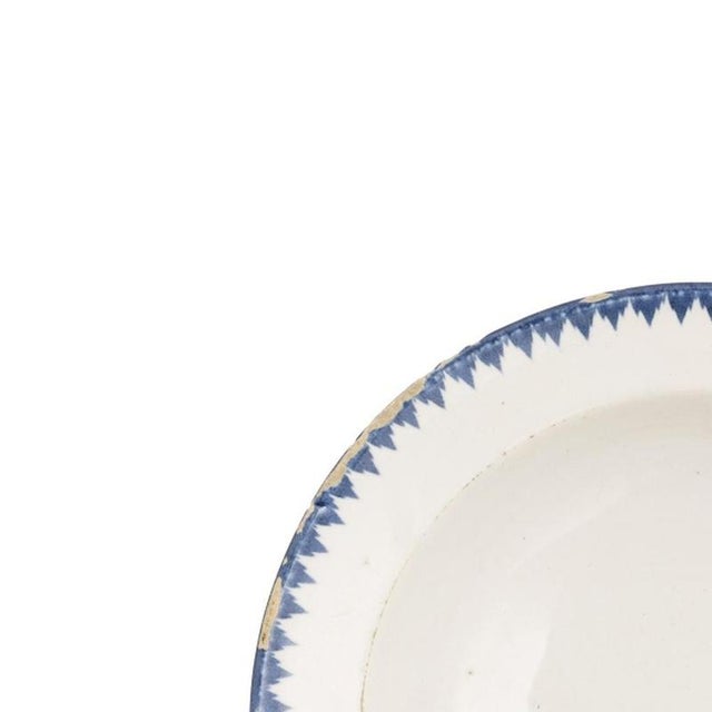 Earthenware - Viana soup plate. Portuguese; made in Viana in the 19th century; glazed decoration in shades of blue....