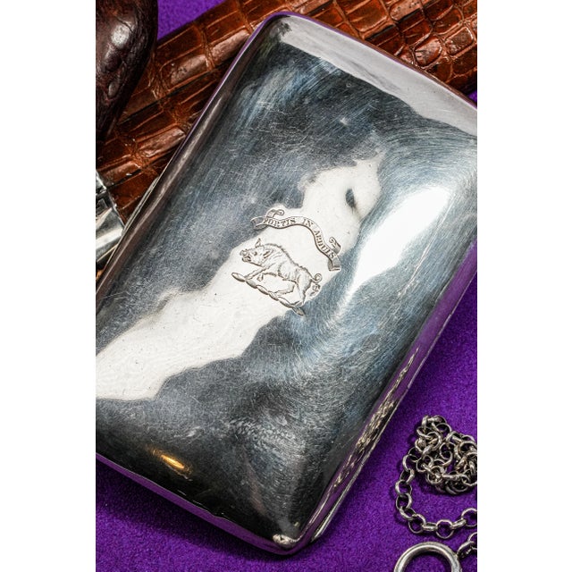 This exquisite English sterling silver cigar case, crafted in Birmingham, England by the esteemed silversmith Joseph...