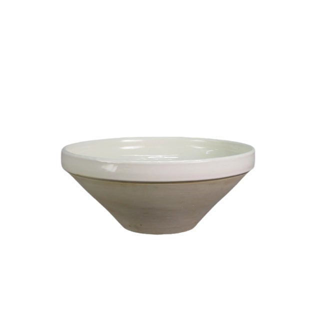This large off-white bowl is handmade, with slight variations that add character and charm to it. Its large size allows...