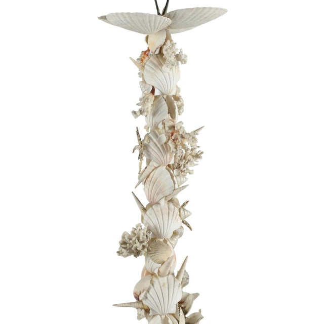 The Vintage Italian "Grotto" Chandelier is a unique and elegant lighting fixture that adds a touch of coastal charm to any...