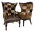 Vintage Carved Wood Patchwork Cowhide Wingback Chairs - Pair For Sale