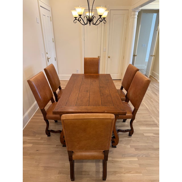 This is a unique Orleans Dining Table and 6 leather chairs made by Henredon Acquisitions. Originally purchased...