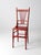 This rare antique spindle back chair makes a bold statement with its vibrant tomato red paint and beautifully aged patina....