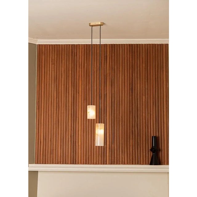 Maniko pipo duoble white alabaster pendant lamp by simone & marcel dimensions: d 10 x w 25 x h 150 cm. Materials:...