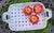 A vintage hand-painted floral ceramic basket. Handcrafted with thick strips of cut ceramic, woven in a basket weave...