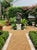 Vintage Hand-Carved Volcanic Stone Whimsical Monkey With Sombrero & Bananas Garden Statue For Sale - Image 12 of 12