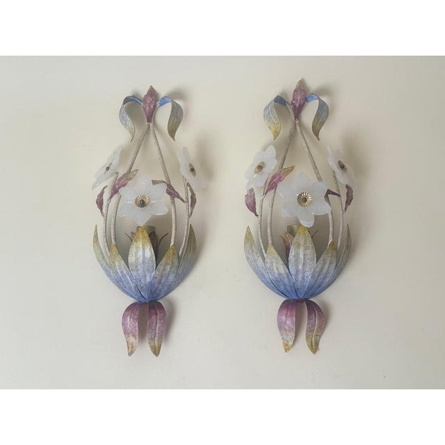 Beautiful pair of italian floral wall sconces from the 1970s/1980s, featuring delicate murano glass flowers with a soft...