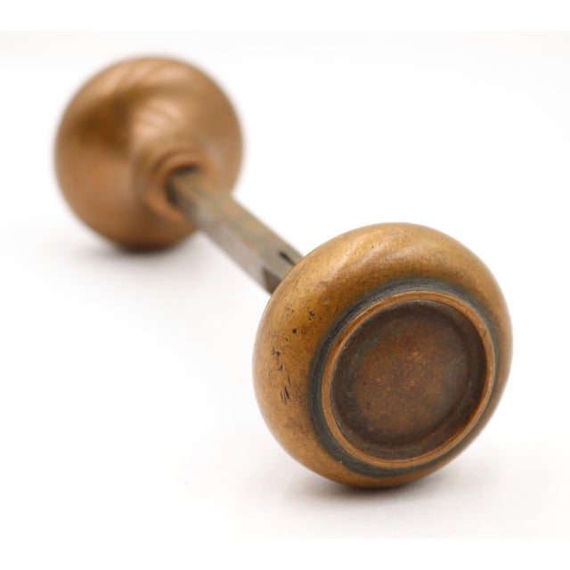 Vintage passage concentric door knobs made of bronze with a patina finish. Good condition with surface wear from prior...