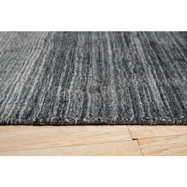 Penelope Nina Charcoal Handmade Wool Rug, Country of Origin: India. This exceptional piece offers a sophisticated...