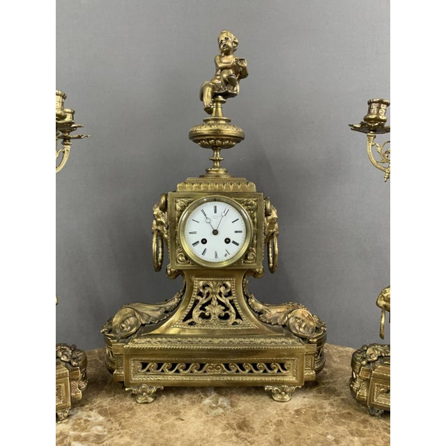 A splendid bronze fireplace set dating from the early 20th century, this exceptional piece combines elegance and history....