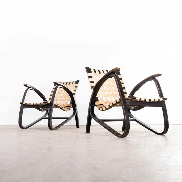 1930's Pair of Webbed Bentwood Armchairs by Jan Vanek - made by Czech producer Up Zavody. Jan Vanek was one of the leading...