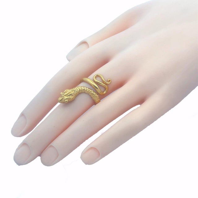 This is a classic cobra snake ring, crafted from 22k yellow gold featuring a coiled body of the snake with its head...