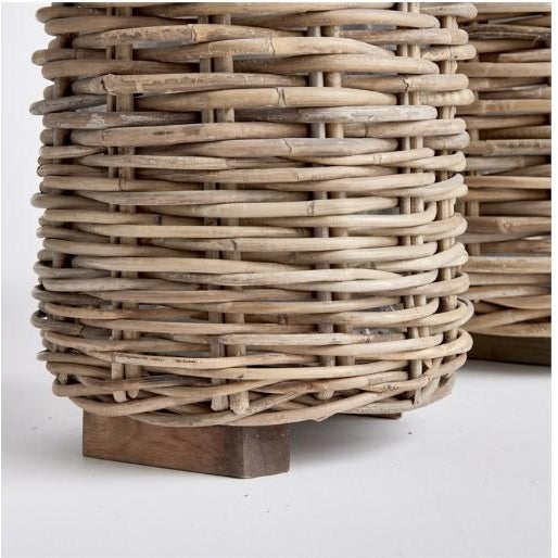 The Set Of Two Marlar Rattan Baskets Dimensions: Large 18 x 17 x 26 - Small 11.25 x 11 x 21 Made of a thick, woven rattan...