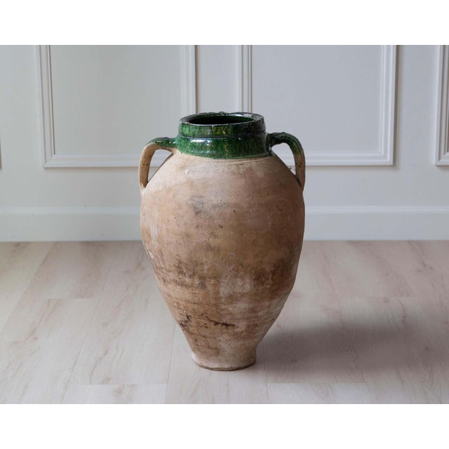 This Mediterranean terracotta jar, dating to the 19th century, is a beautiful example of utilitarian pottery elevated by...