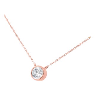 AGS Certified 10K Rose Gold 1/5 Cttw Bezel Set Round Diamond Solitaire 16-18" Adjustable Pendant Necklace (I-J Color, VS1-VS2 Clarity) For Sale