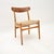 A beautiful and iconic Danish vintage CH-23 chair by Hans Wegner for Carl Hansen. This was made in Denmark, it is an early...