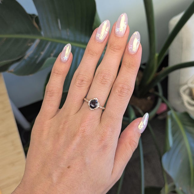This regal 2 carat purple spinel ring is crafted in solid 14K gold and features sparkling earth mined diamond accents for...