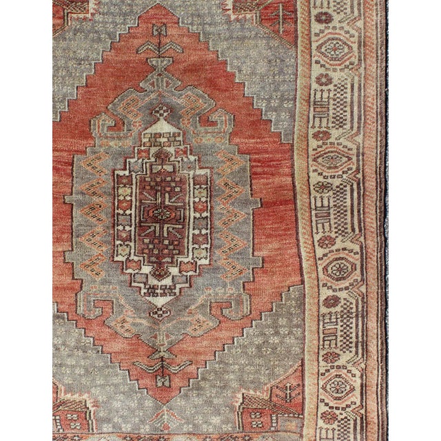 Colorful Vintage Turkish Oushak Rug with Geometric-Tribal Motifs Keivan Woven Arts/ rug/EN-140179 origin/Turkey Measures:...